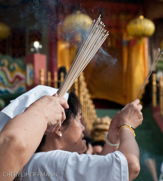 Women praying with incense