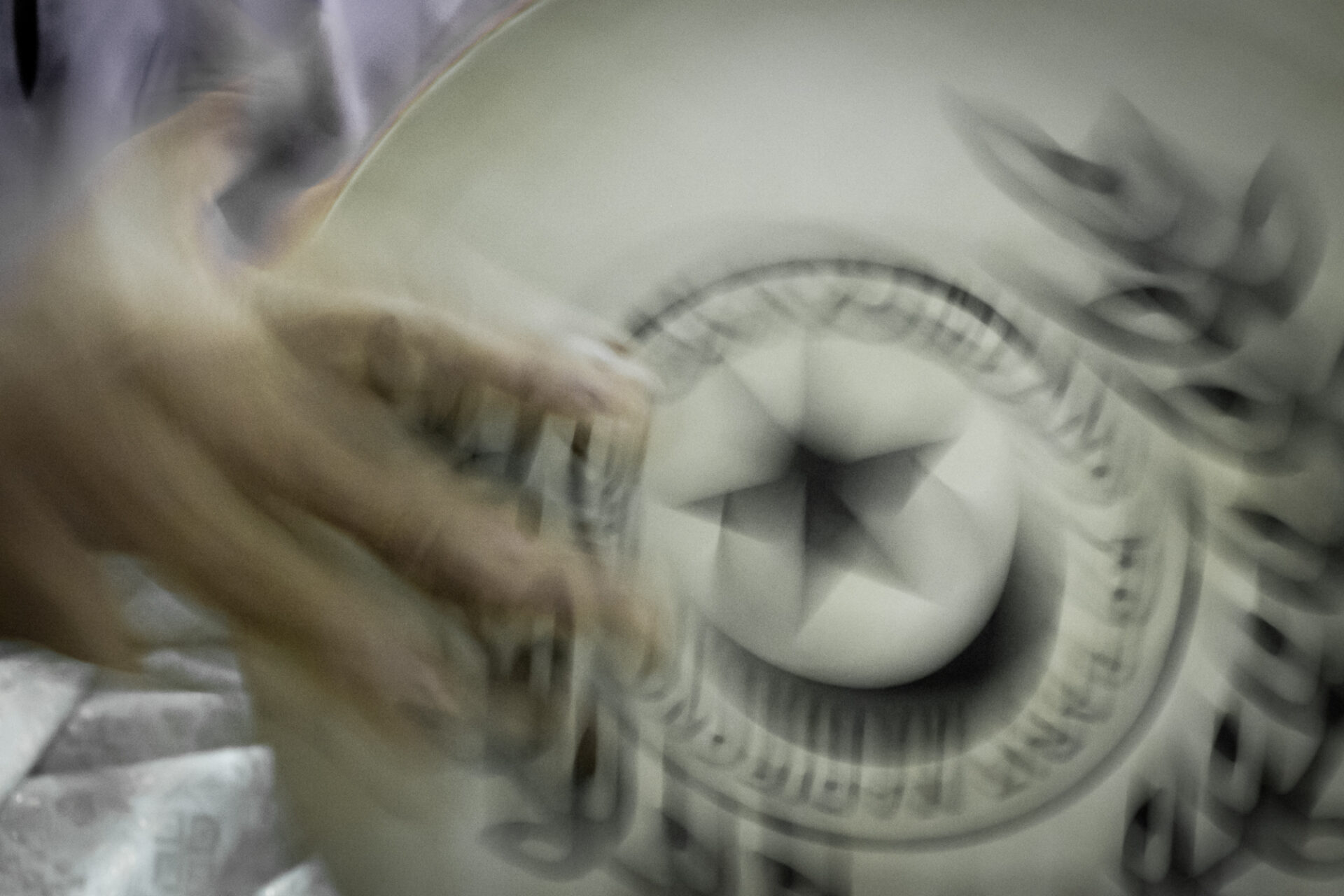 Partially clear image of a drum with floral decor and star