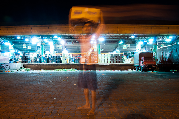 A man holding a box over his head