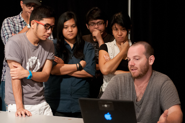 People discussing over a laptop