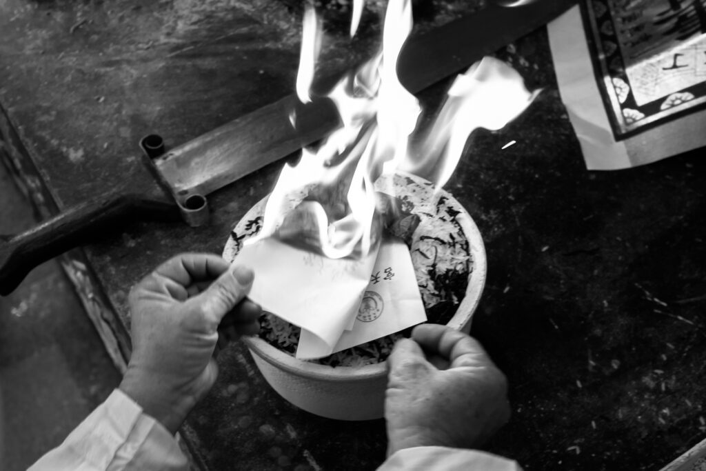 A man burning paper