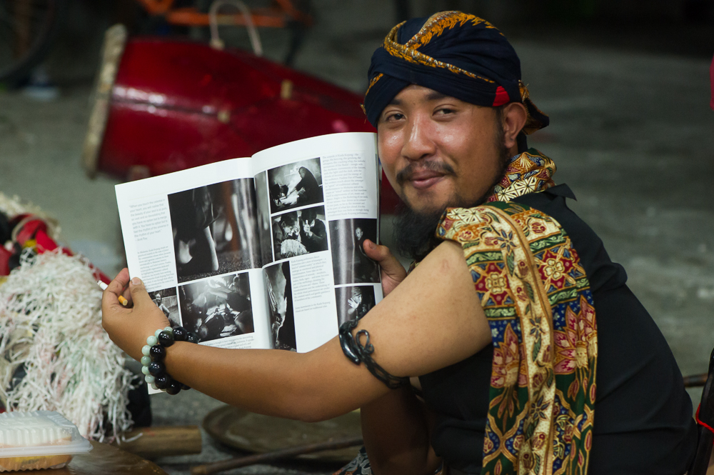 A man holding a photobook