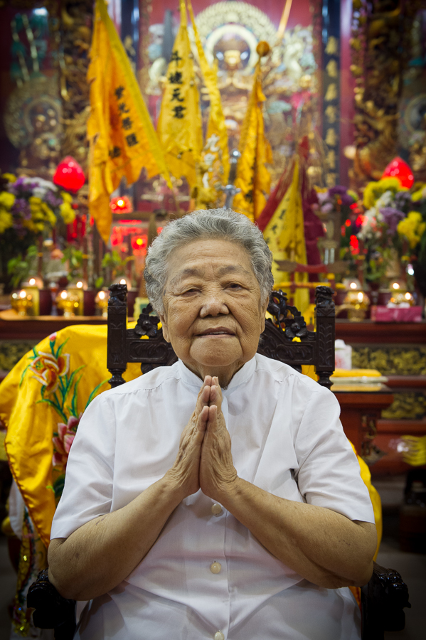 A woman in front of an altar