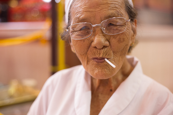 A woman eating a lollipop