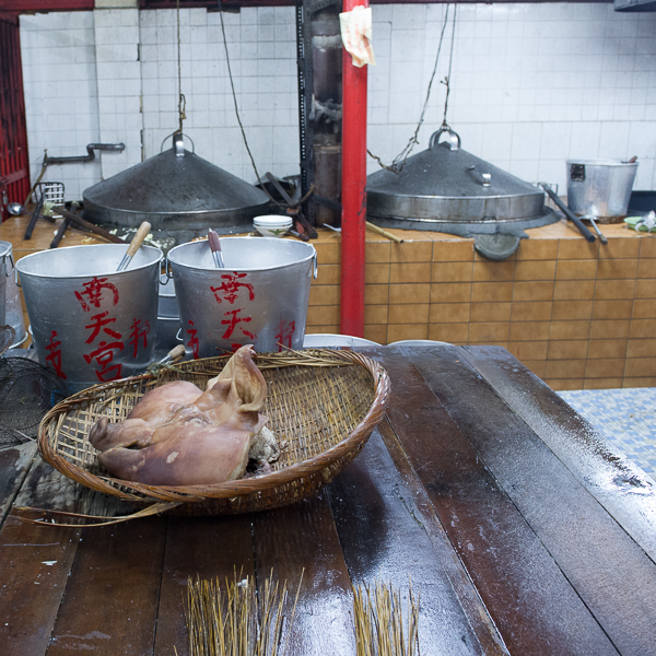 A pig’s head in a kitchen