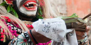 A man in makeup during Nine Emperor Gods Festival